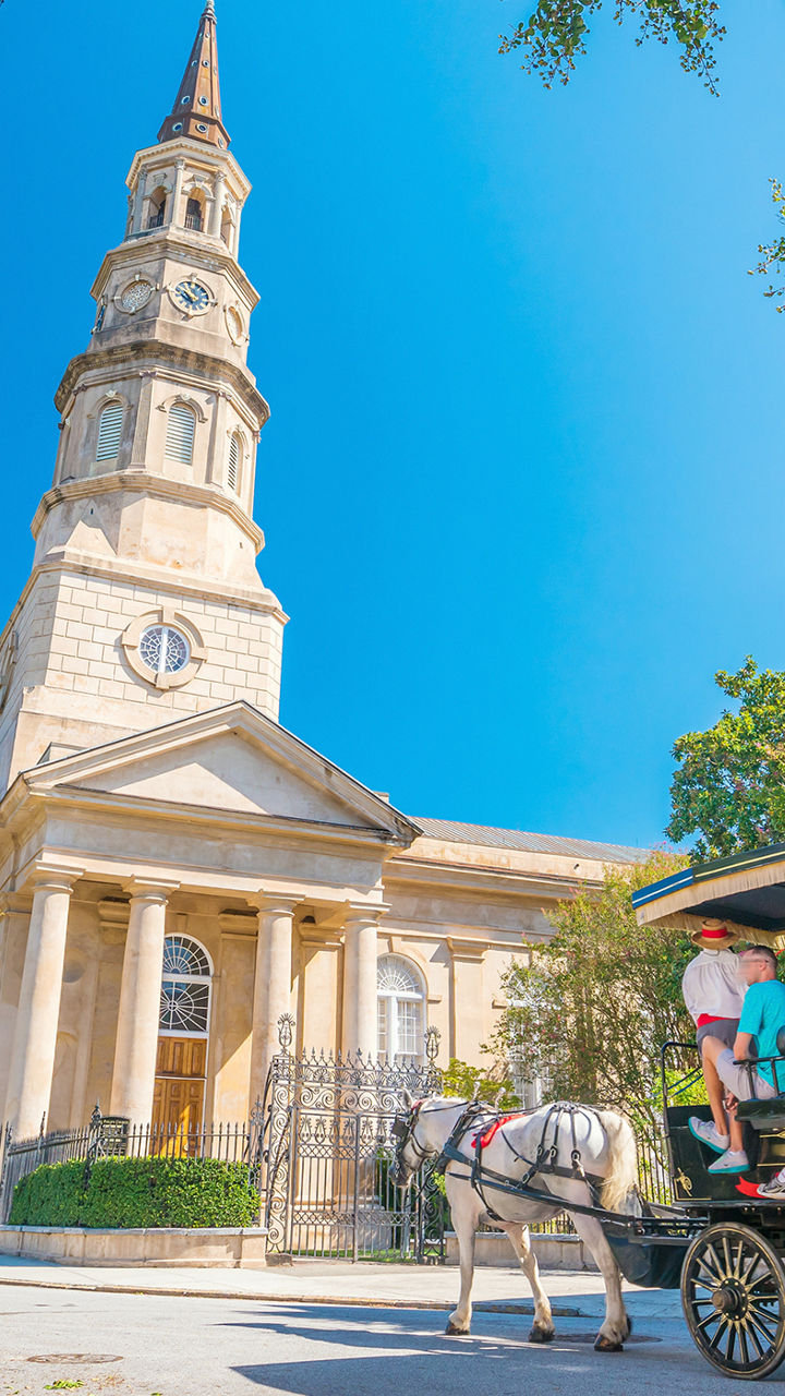 Horse-drawn carriage near historic church