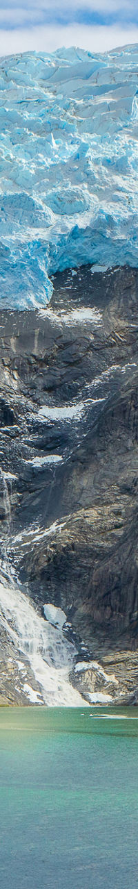 Majestic glacier waterfall in serene landscape