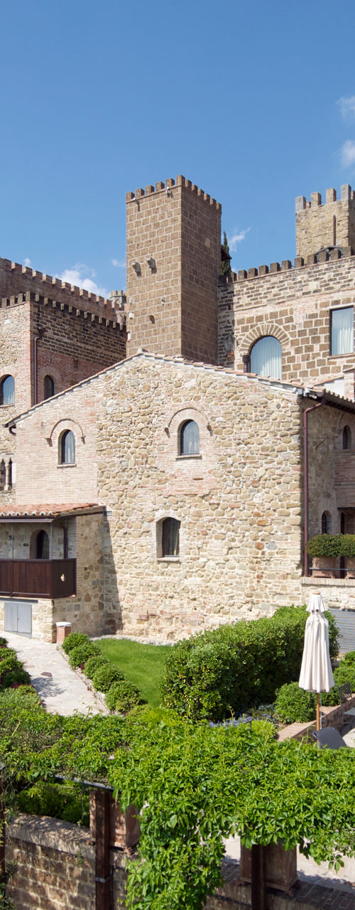 Historic stone castle with lush gardens