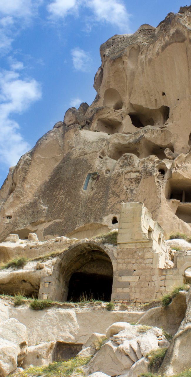 Ancient rock formations under blue sky
