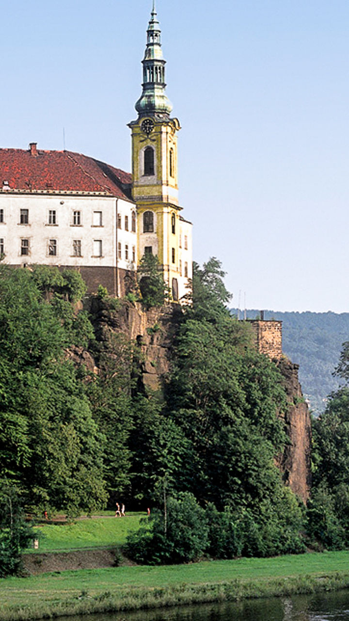 Historic riverside monastery with scenic view