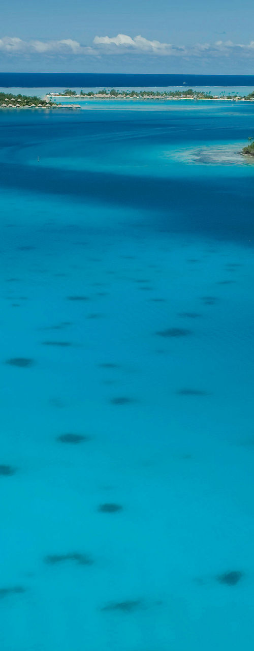 Sailboat on turquoise tropical waters