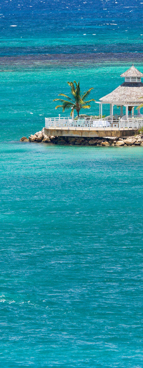 Catamaran sailing near tropical island resort