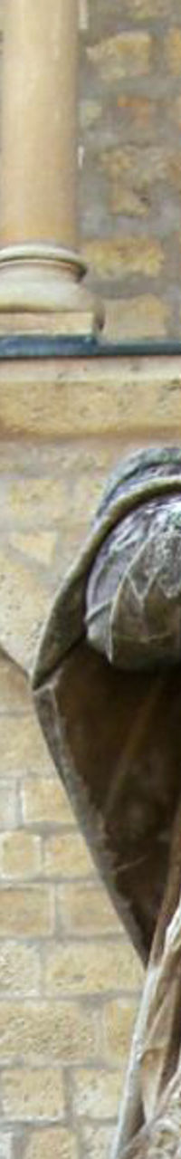 Historic statue outside medieval building