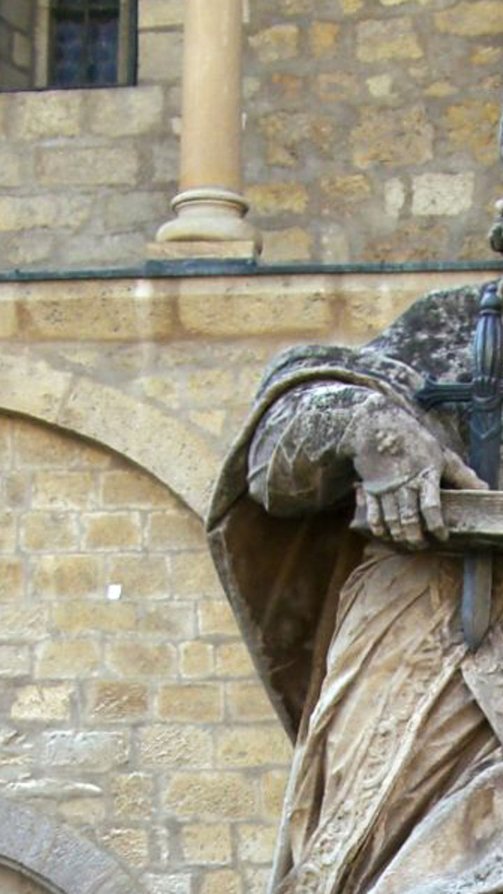 Historic statue outside medieval building