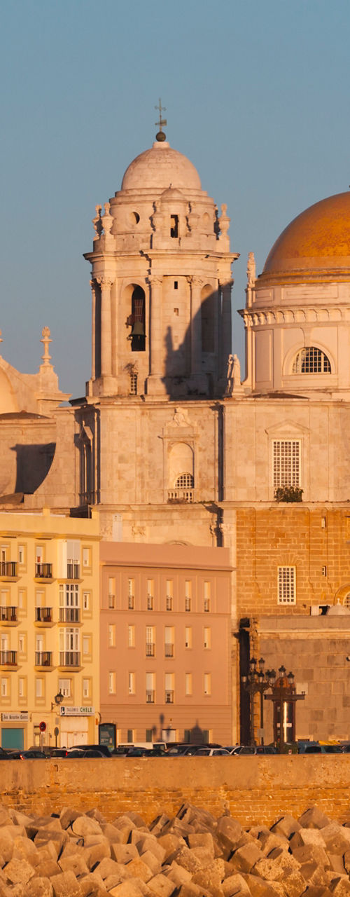 Sunlit Cathedral by Coastal Seawall
