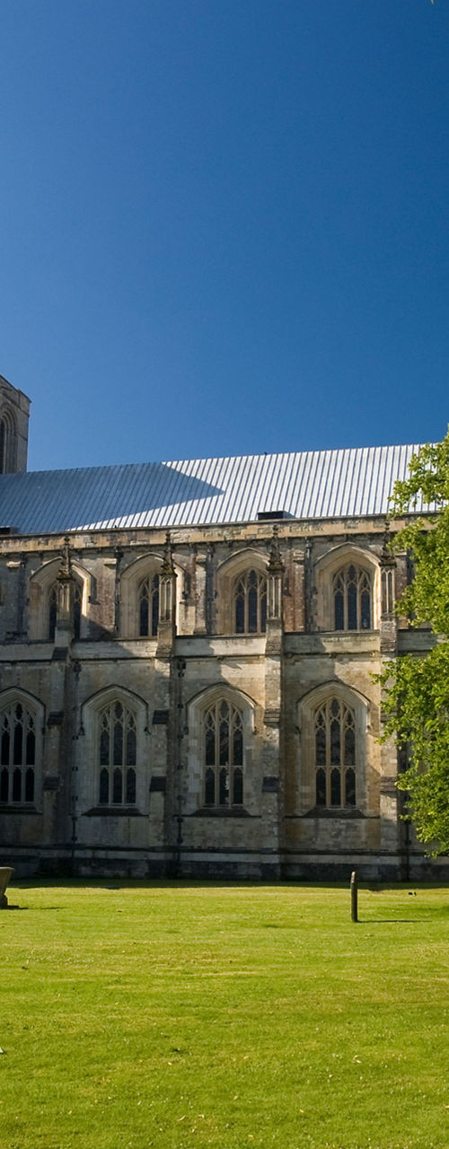 Historic cathedral with lush green lawn