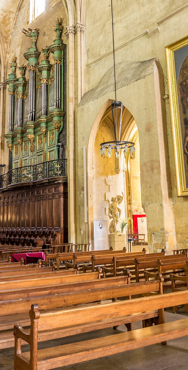Historic cathedral interior with wooden pews