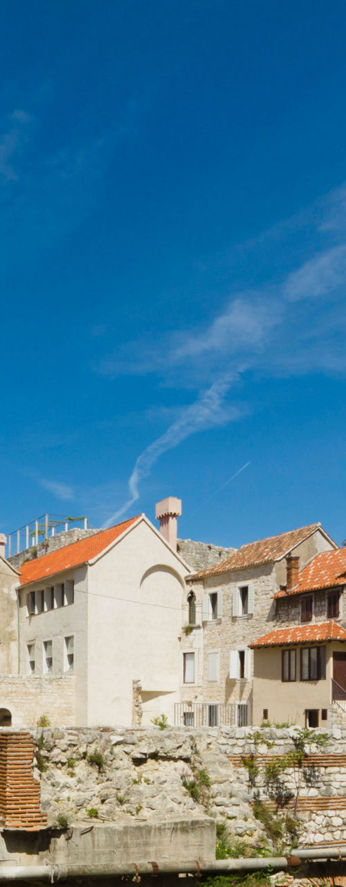 Historic stone buildings with bell tower