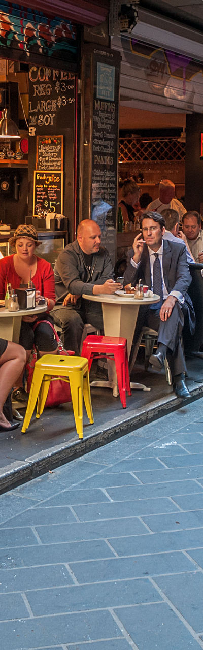 Bustling alleyway café scene with diners