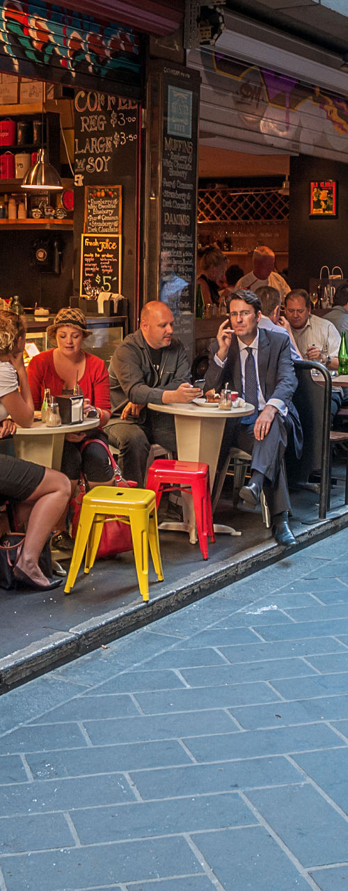 Bustling alleyway café scene with diners