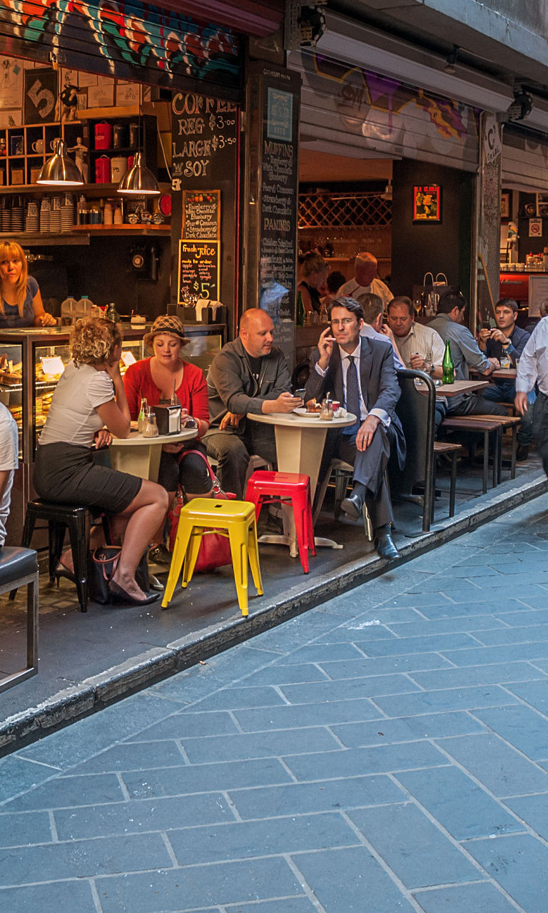 Bustling alleyway café scene with diners