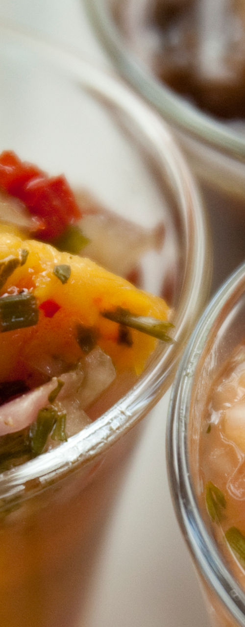 Assorted seafood appetizers in glass cups