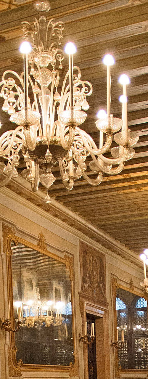 Elegant hallway with chandeliers and mirrors