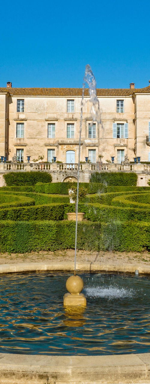 Elegant estate with manicured gardens and fountain