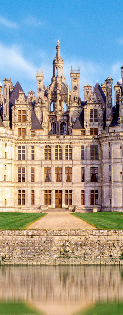 Majestic French castle with water reflection