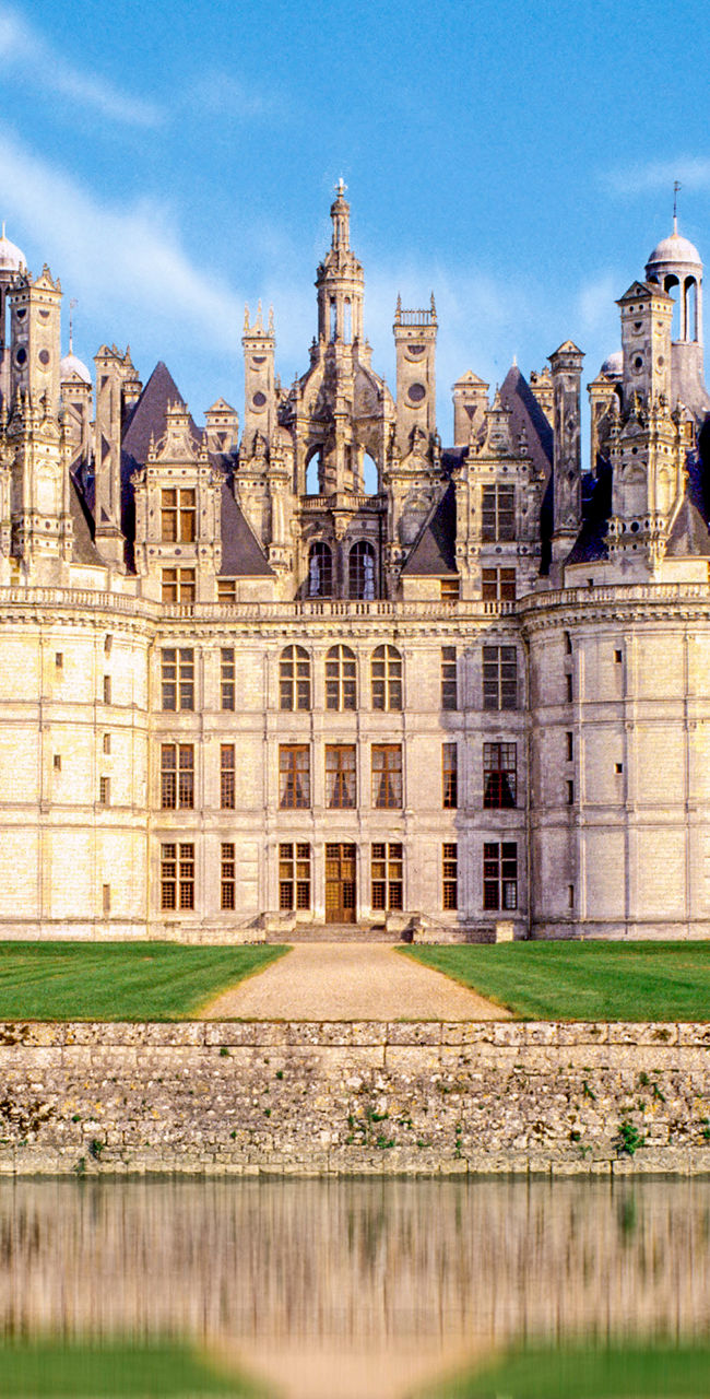 Majestic French castle with water reflection