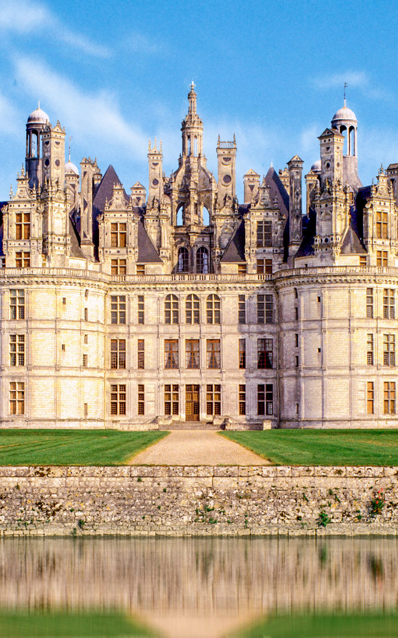 Majestic French castle with water reflection