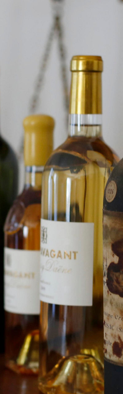 Assorted wine bottles on wooden table
