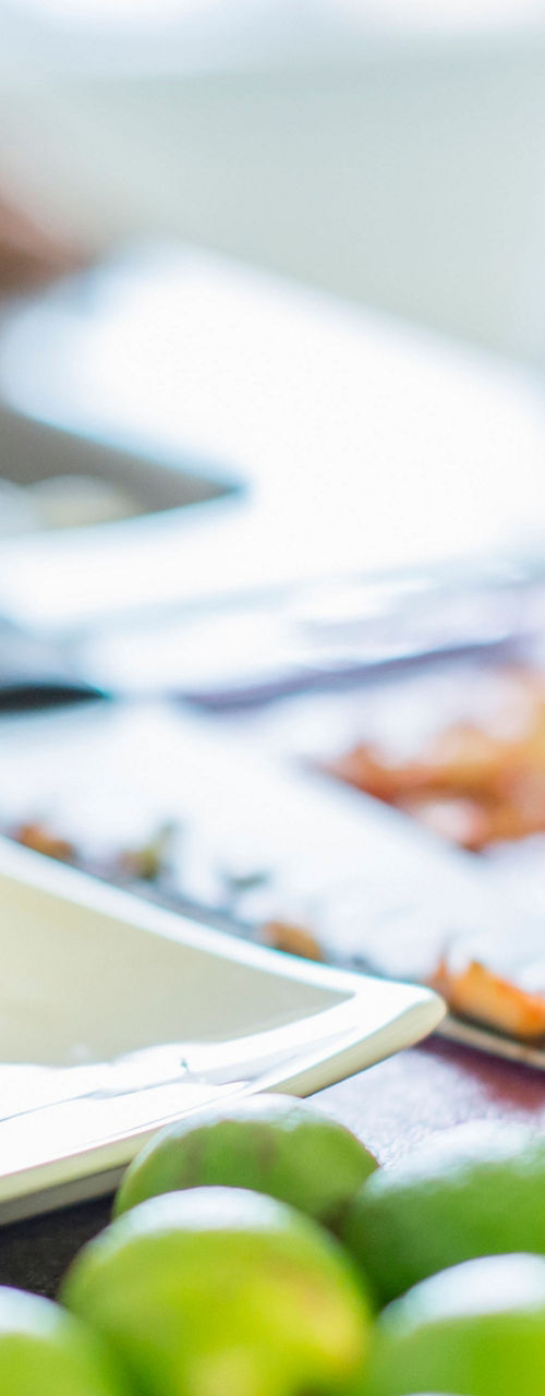 Chef preparing pork with fresh limes
