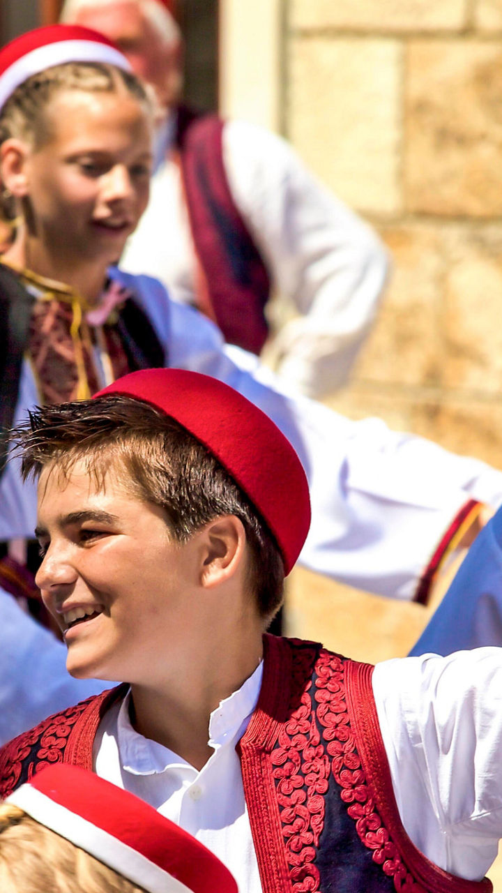 Traditional folk dancers in vibrant costumes