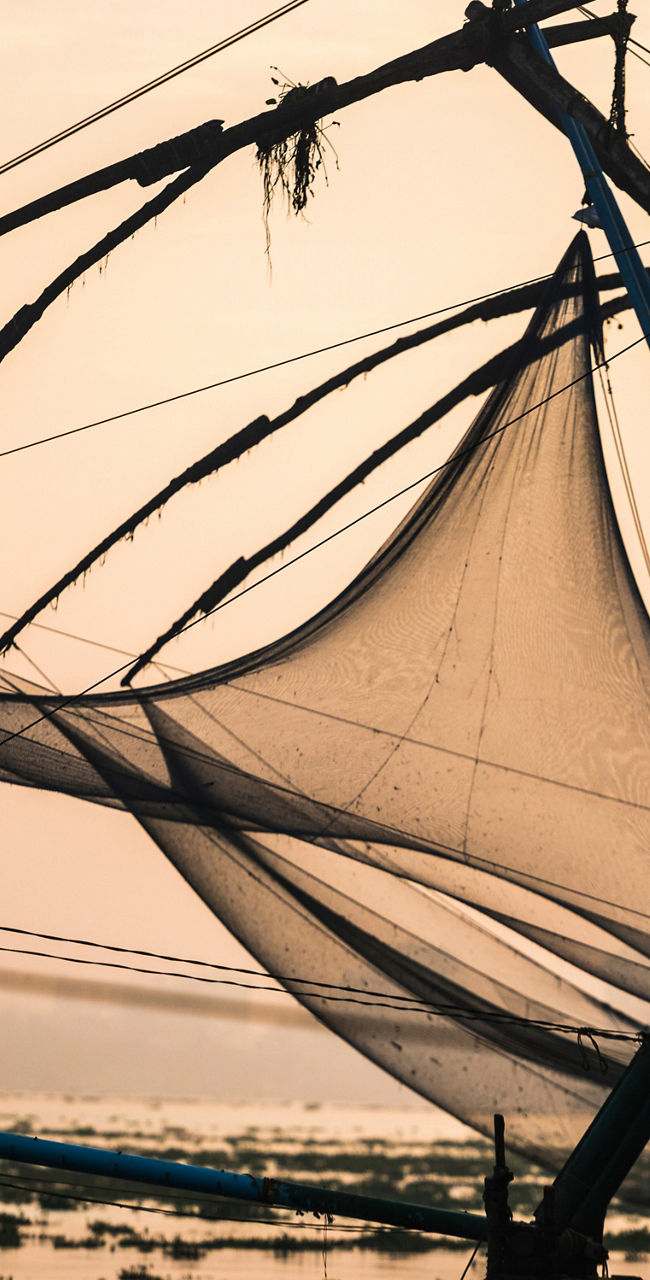 Silhouette of fisherman with Chinese fishing nets