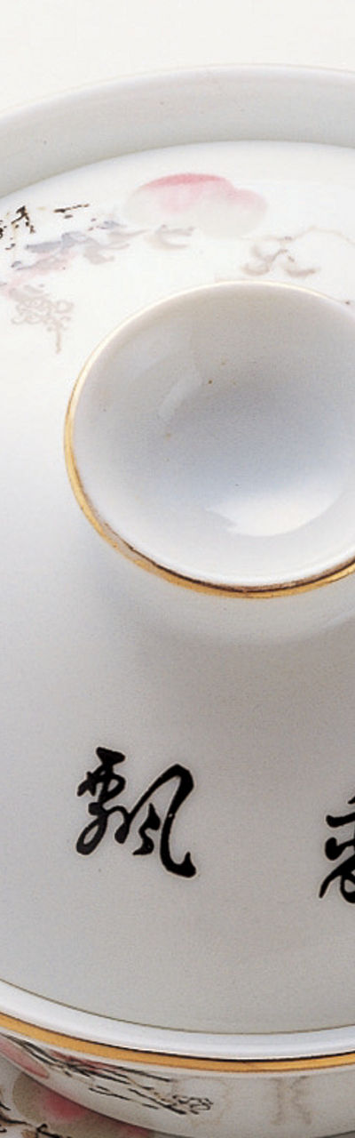 Elegant porcelain tea set on wooden stand