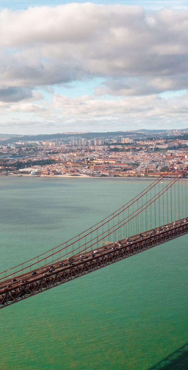 Christ the King statue overlooking Lisbon bridge