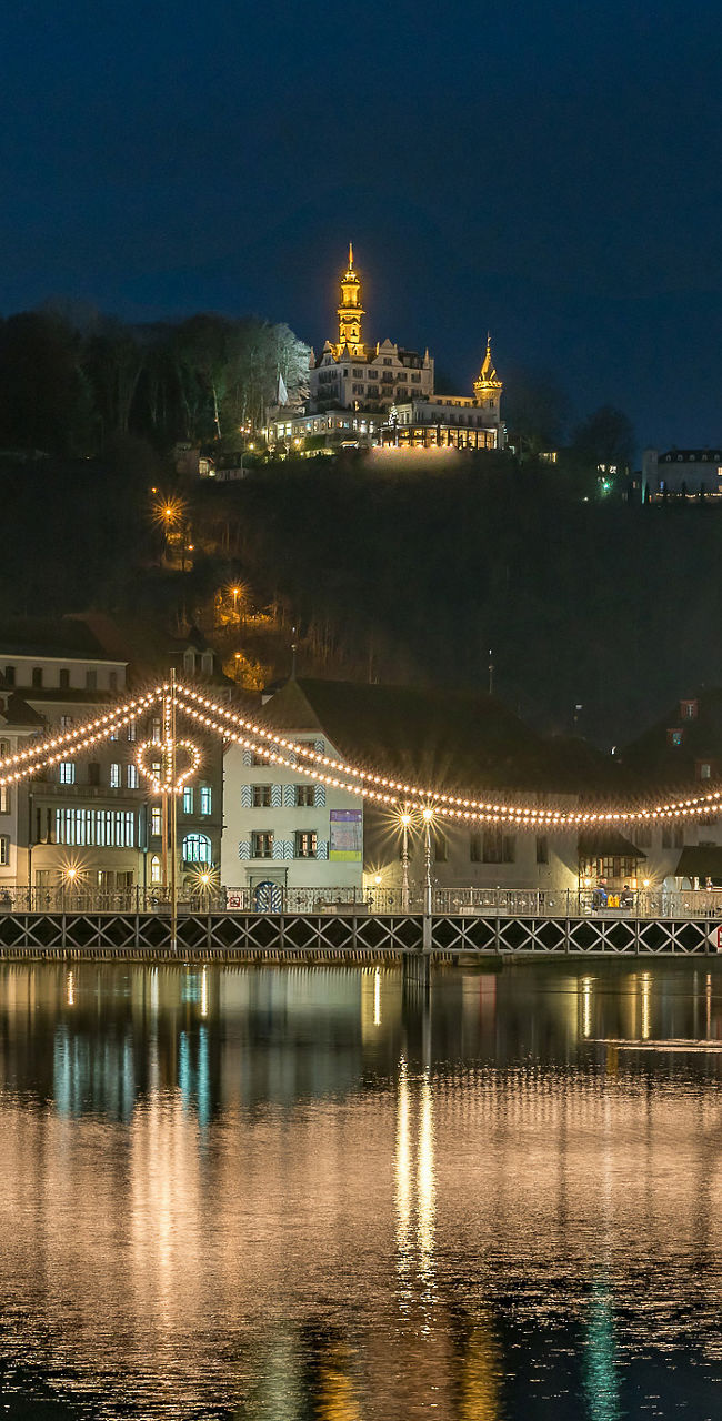 Scenic night view of illuminated city bridge