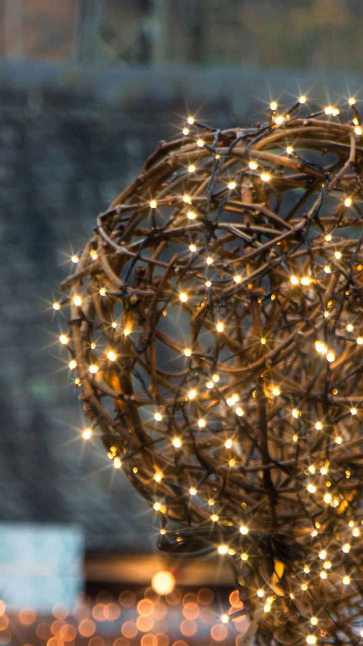 Festive glowing lights in outdoor setting