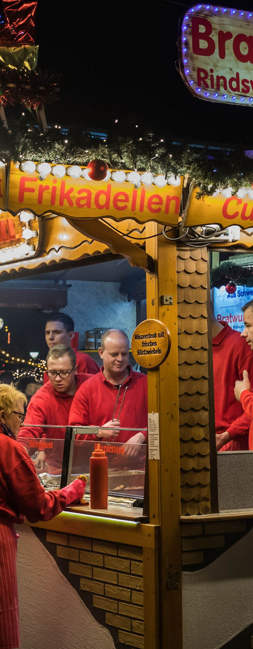 Festive food stall serving bratwurst and steak