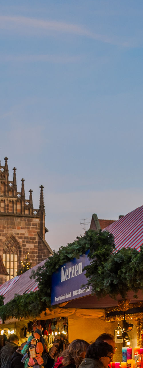 Festive Christmas market with church backdrop