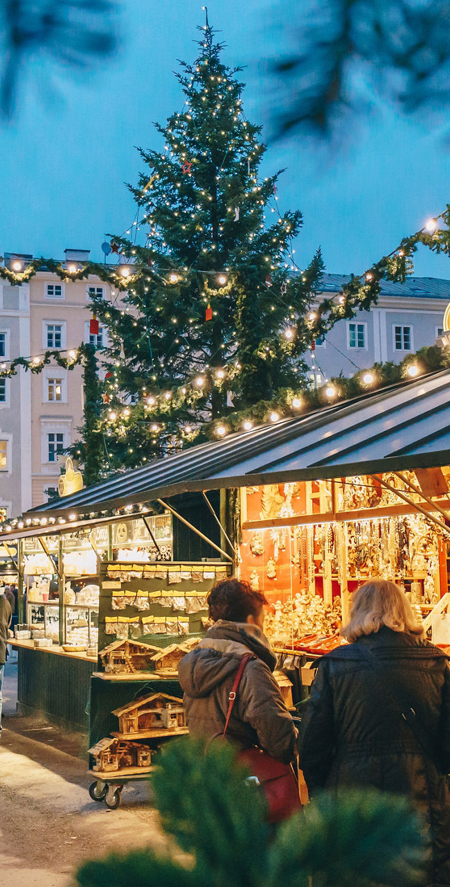 Festive outdoor Christmas market at dusk