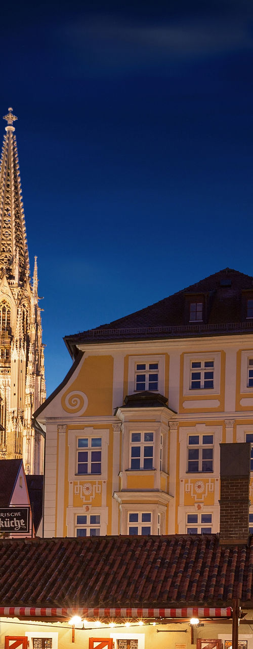 Illuminated Christmas tree in historic town square