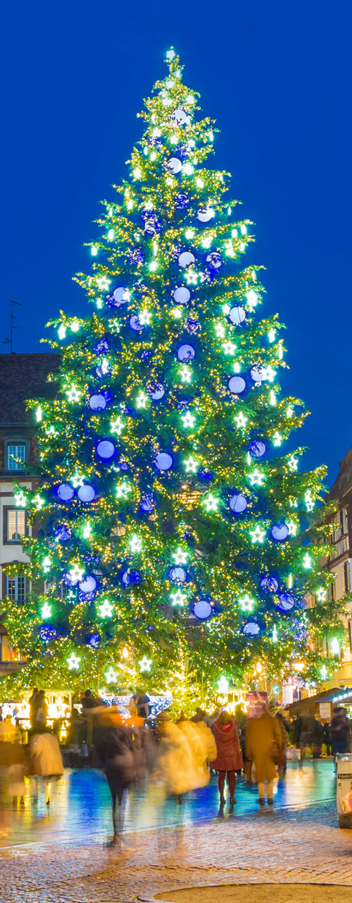 Illuminated Christmas tree in city square