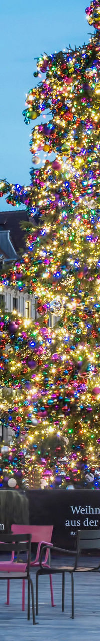 Festive Christmas tree in urban plaza