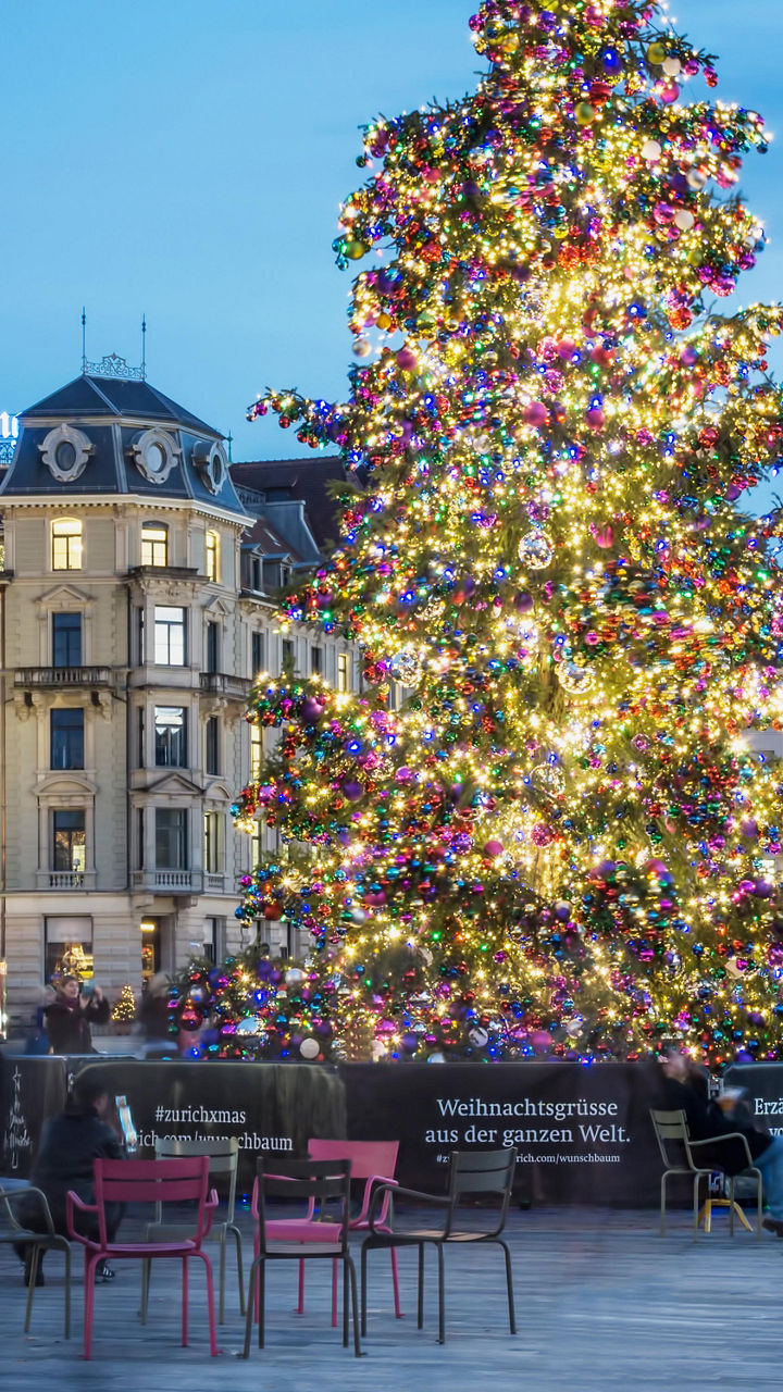 Festive Christmas tree in urban plaza