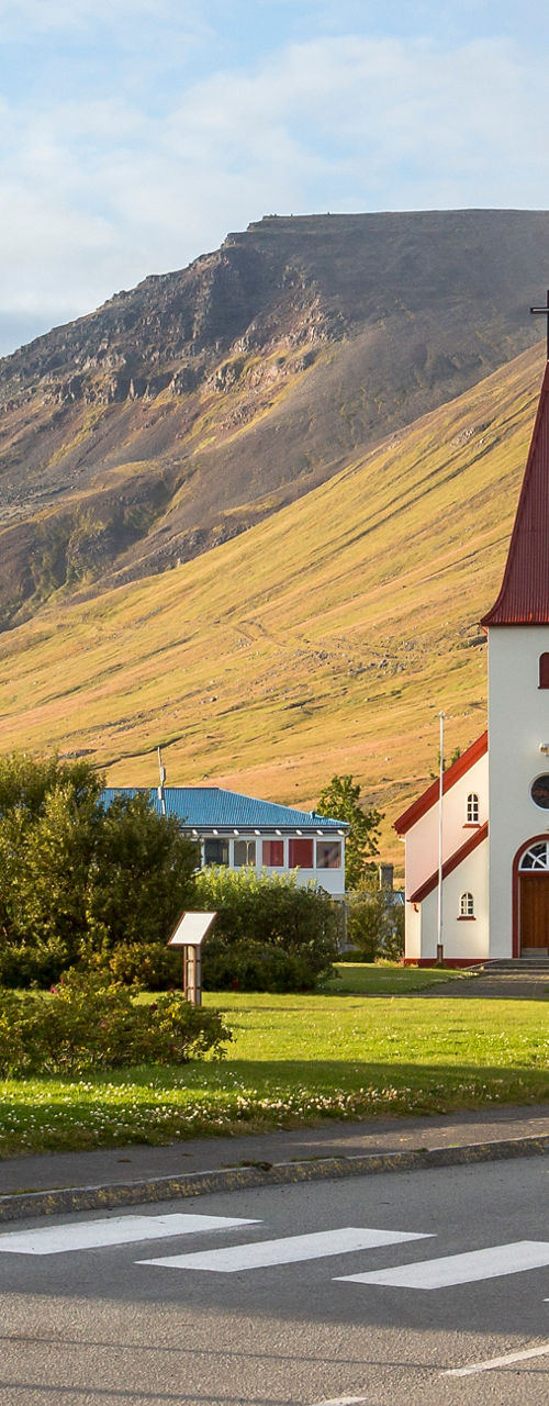 Scenic church with mountain backdrop