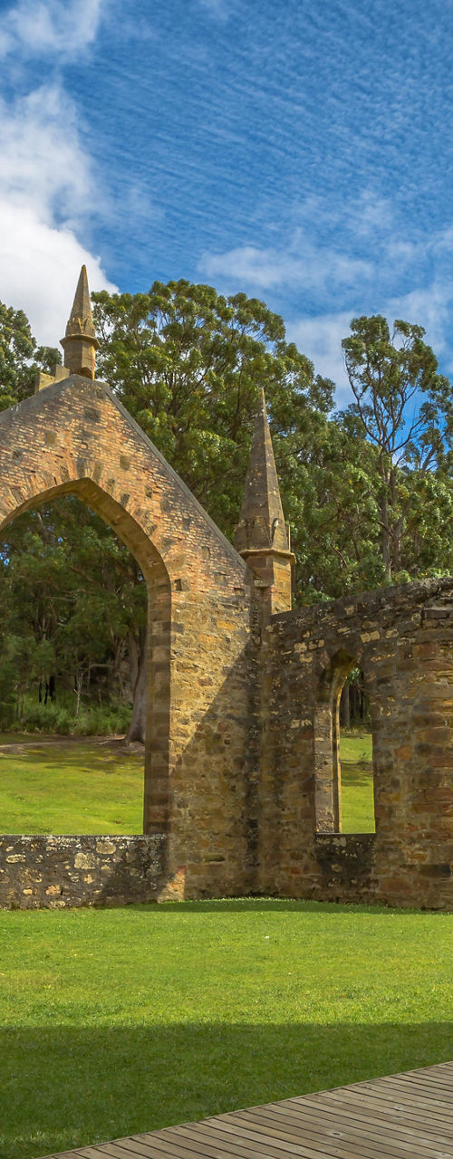 Historic stone ruins in lush green setting