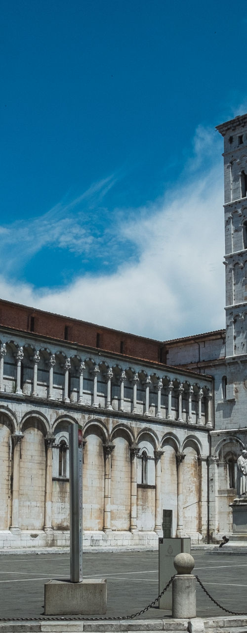 Cyclists near historic Italian cathedral