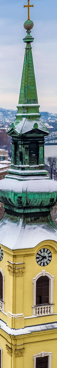 Snowy Budapest cityscape with historic church