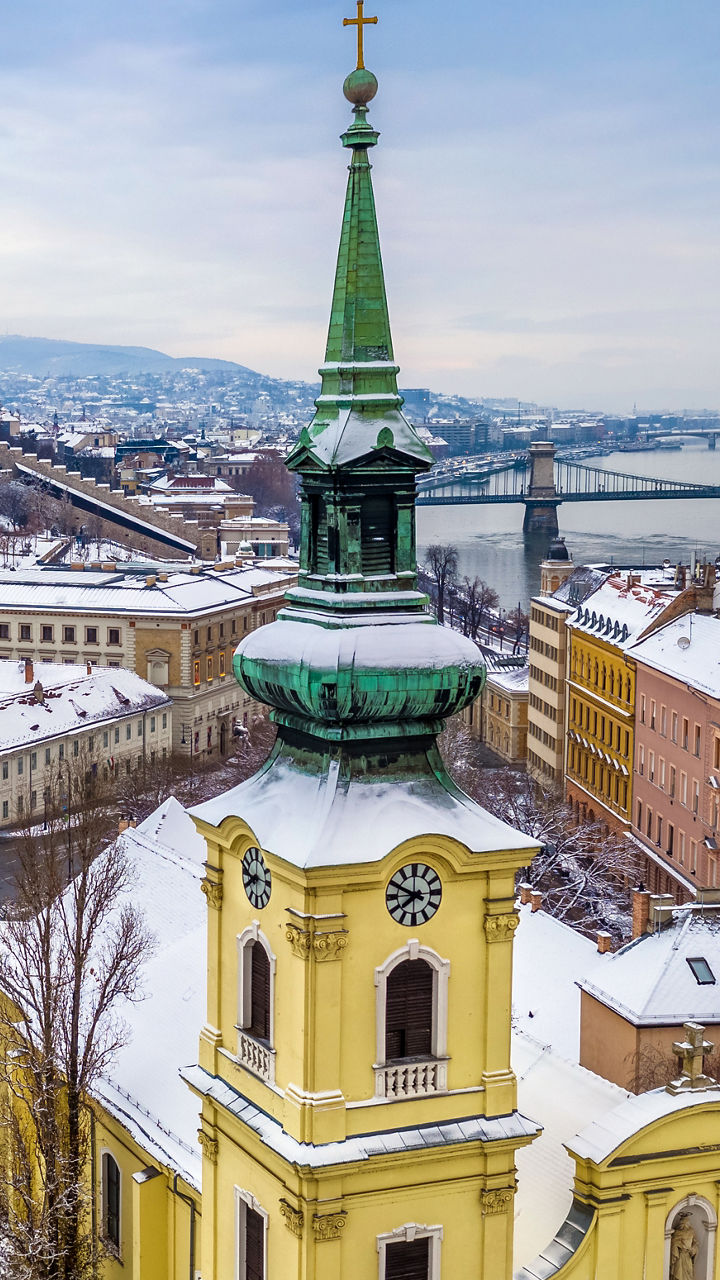 Snowy Budapest cityscape with historic church