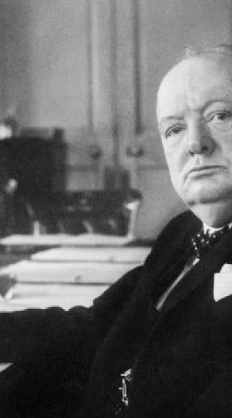 Historical figure in formal office setting