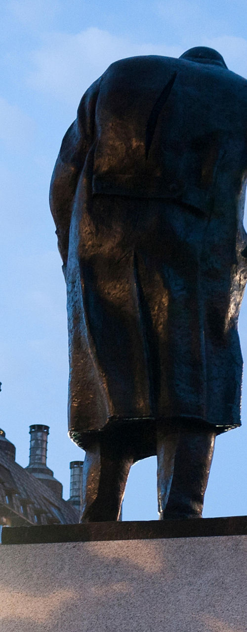 Statue near Big Ben at dusk