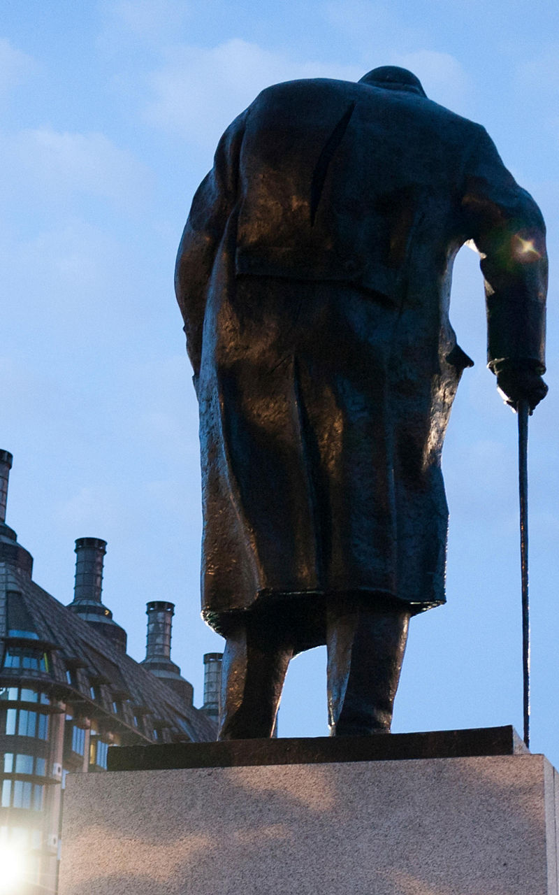 Statue near Big Ben at dusk