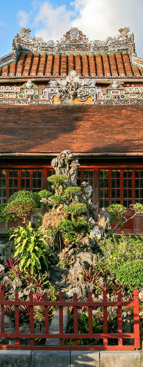 Traditional Asian architecture with lush garden