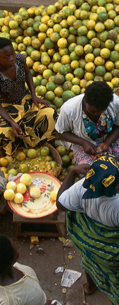 Outdoor fruit market with vibrant lemons