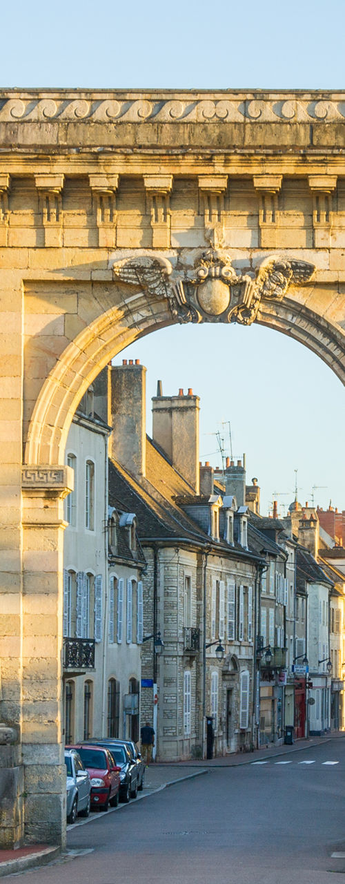 Historic stone archway in European town