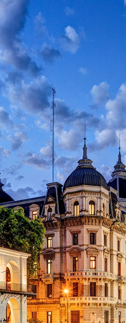 Historic Cabildo and cityscape at dusk
