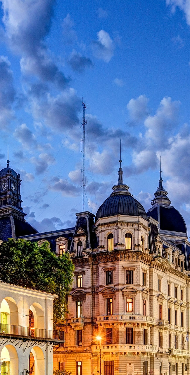 Historic Cabildo and cityscape at dusk